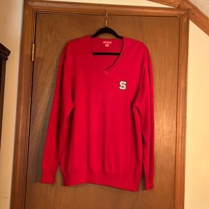 Men’s red, V-neck, soft  cotton blend sweater w/NC State logo on chest size XL